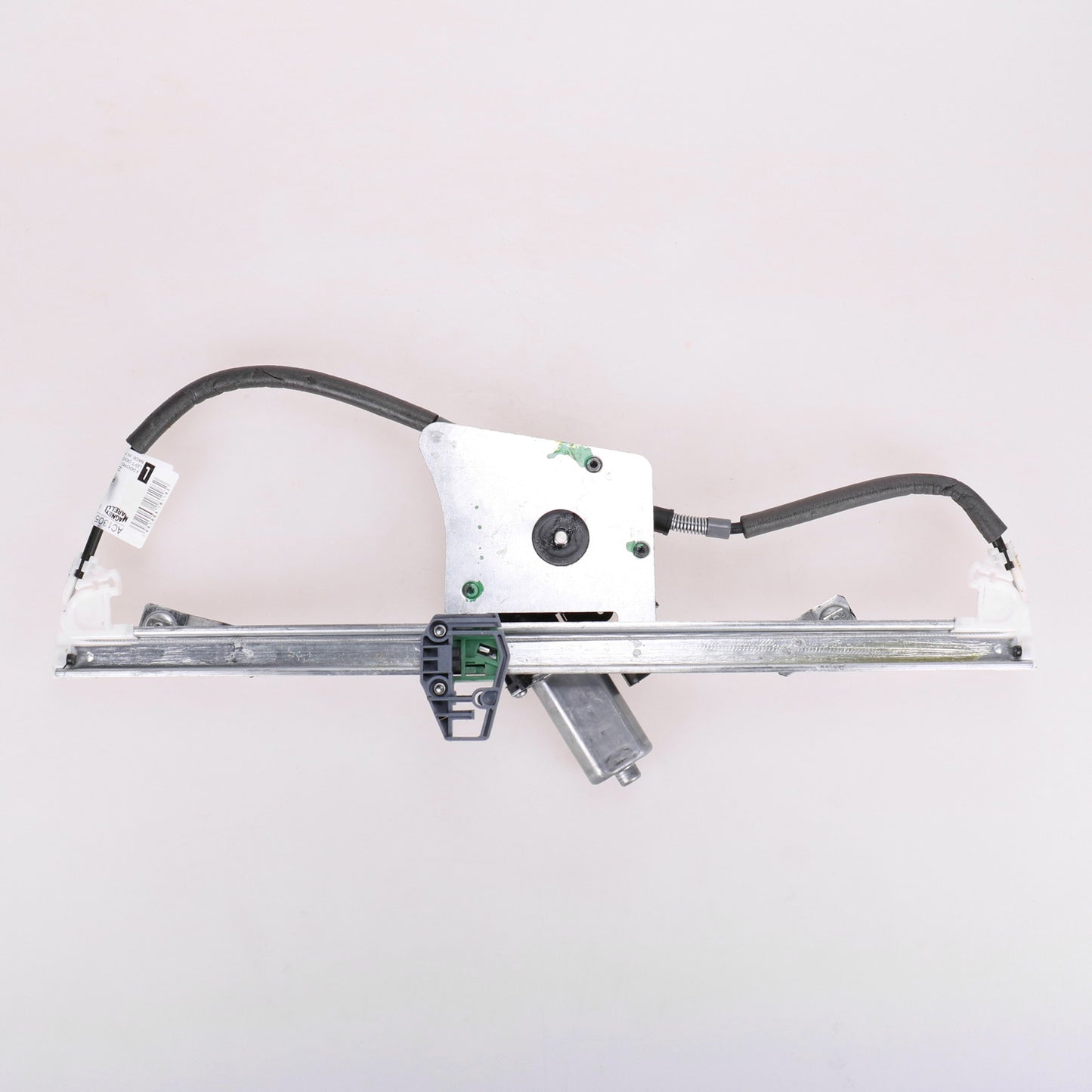 Podnośnik elektryczny przedni lewy z silnikiem Magneti Marelli