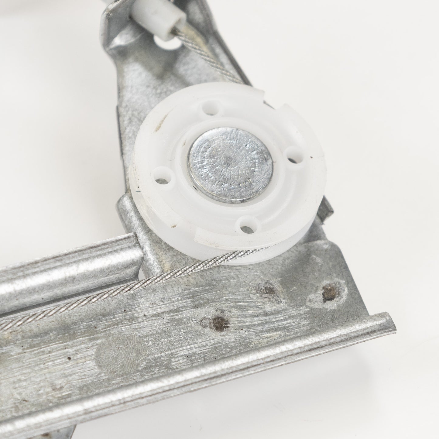 Podnośnik szyby ręczny tylny lewy Magneti Marelli